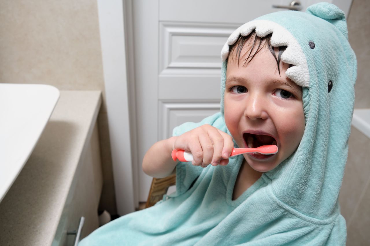 kid brushing teeth